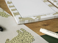 Load image into Gallery viewer, Close up of the soft coated wheaten terrier patterned A5 notepad. Showing the corner of the notepad and the quality of the paper.