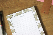 Load image into Gallery viewer, Close up of the Soft Coated wheaten Terrier A5 notepad showing the top of the notepad. This is a lined notepad.