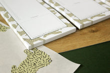 Load image into Gallery viewer, Close up show of the DL To Do List notepad designed by Harriet Billingham illustration. Showing lots of dog poses and the 50 pages.