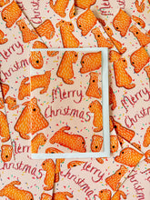 Load image into Gallery viewer, drawn by harriet billingham. Merry Christmas card with gingerbead wheaten on in a pattern