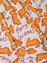 Load image into Gallery viewer, photograph lay down of merry christmas gingerbread wheatens in a pattern