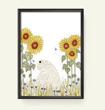 Load image into Gallery viewer, A framed art print featuring a whimsical illustration of a soft coated wheaten terrier sitting in a field of yellow sunflowers, displayed on a light cream background.
