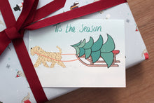 Load image into Gallery viewer, Wheaten Christmas wrapping paper with ribbon and a Christmas card
