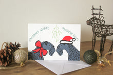 Load image into Gallery viewer, Kerry blue terriers under mistletoe wearing a Santa hat and ribbon
