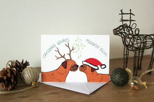 Border Terrier Christmas card, two border terrier under mistletoe wearing antlers and a Santa hat