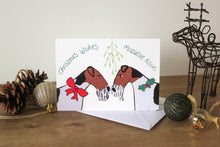 Load image into Gallery viewer, two wire fox terriers under mistletoe wearing holly and a red ribbon
