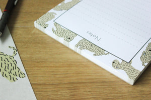 Soft Coated wheaten terrier notepad showing the top glue edge of the notepad.