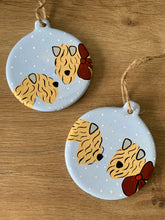 Load image into Gallery viewer, Two Soft Coated Wheaten Terrier Decorations in the snow 
