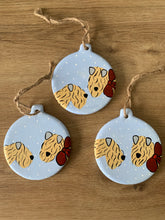 Load image into Gallery viewer, Example of three soft coated wheaten terrier Christmas decorations in the snow together
