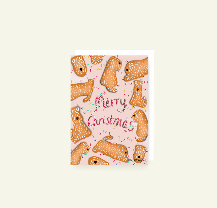 Designed and drawn by Harriet Billingham is this Merry Christmas Gingerbread Wheaten Pattern Christmas card showing lots of wheatens made out of gingerbread.
