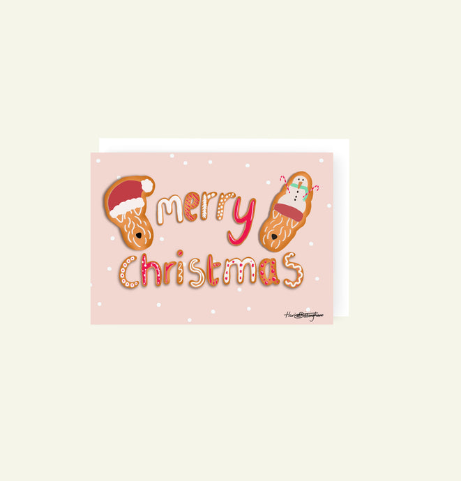 Gingerbread theme christmas card with Merry christmas in the middle and two Wheatens either side 