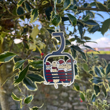 Load image into Gallery viewer, Decorative ornament shaped like a cornet with a flag design, hanging on a tree.
