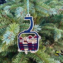 Load image into Gallery viewer, Decorative ski lift ornament with skiers on a Christmas tree.

