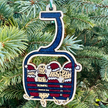 Load image into Gallery viewer, Decorative Christmas ornament shaped like a ski lift with cartoon characters on a tree.
