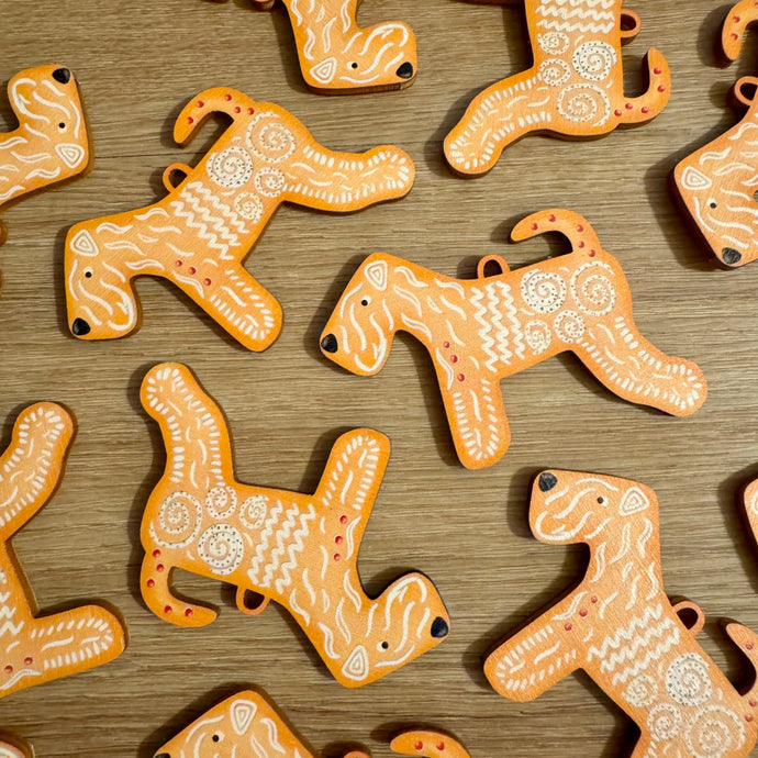 laydown of new soft coated wheaten Terrier Christmas decorations