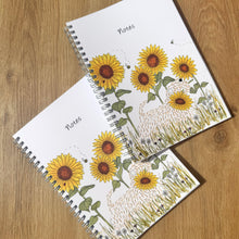 Load image into Gallery viewer, Two spiral-bound notebooks with sunflower design on a wooden surface

