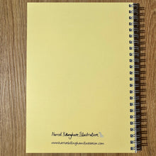 Load image into Gallery viewer, Yellow notebook with spiral binding on a wooden surface
