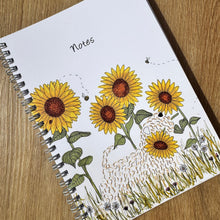 Load image into Gallery viewer, Notebook with sunflower design on a wooden surface
