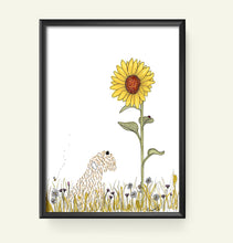 Load image into Gallery viewer, A framed art print featuring a whimsical illustration of a dog made of letter patterns looking up at a giant sunflower, set against a white background with a black frame.
